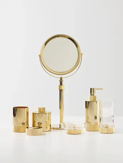 Accessoires de salle de bains DECOR WALTHER dorés et miroir grossissant — showroom RS.D Lyon